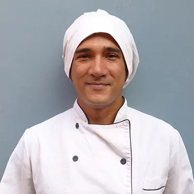 Chef Fabricio Robles creating Mediterranean-inspired dishes for guests at Soul Farm